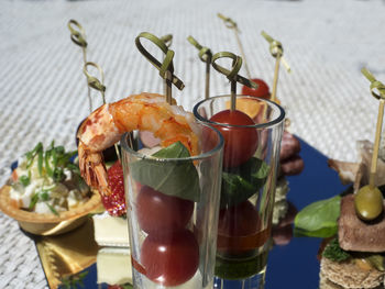 Close-up of various canapes and snacks served on table