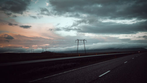 Highway against sky during sunset