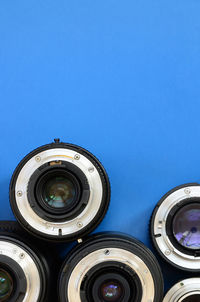 High angle view of lens on blue background