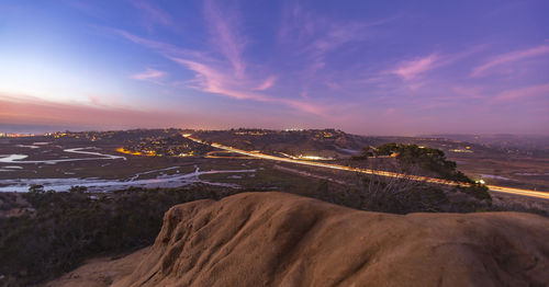 Idyllic view of landscape against sky during sunset