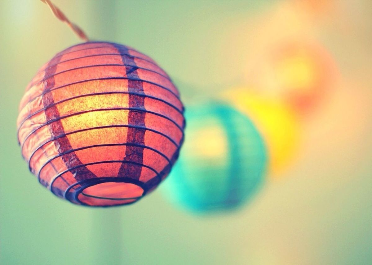 multi colored, sphere, mid-air, close-up, low angle view, balloon, hot air balloon, circle, lighting equipment, geometric shape, pattern, focus on foreground, indoors, decoration, illuminated, hanging, shape, colorful, ball, no people