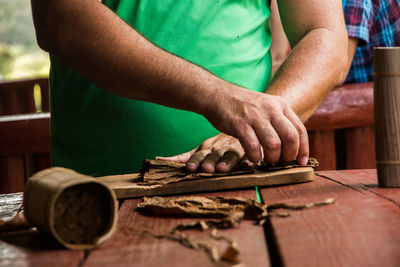 Close-up of man working on wood