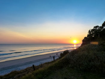 Scenic view of sea at sunset