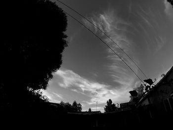 Low angle view of building against cloudy sky