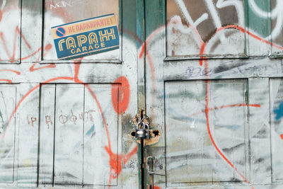 Close-up of graffiti on garage door