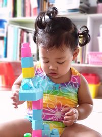 Cute girl playing with toy