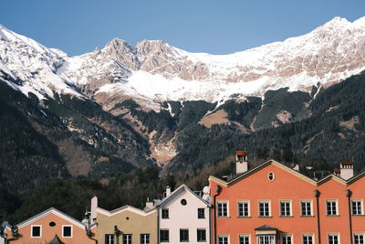 The colorful houses in front of the mountains