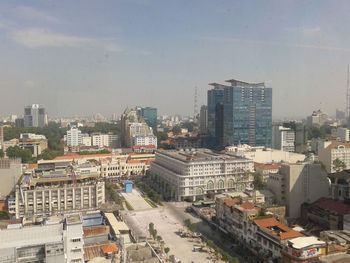 Urban skyline against sky