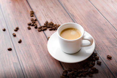 High angle view of coffee cup on table