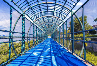 Low angle view of empty footbridge