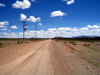 Road by land against sky