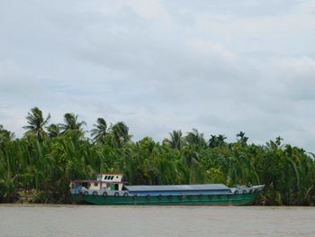 Boat in sea against sky