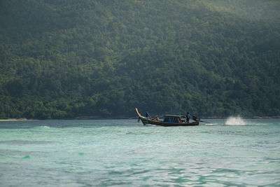 Boat in sea against sky