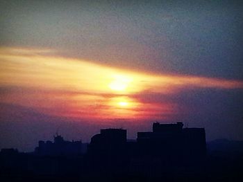 Silhouette of buildings at sunset
