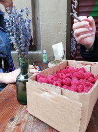 Hand holding ice cream in box