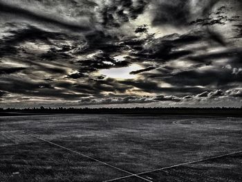 Scenic view of landscape against cloudy sky