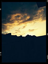 View of buildings against sky at sunset