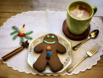 High angle view of cookies and coffee on table