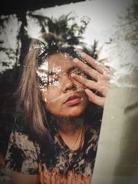 Portrait of young woman looking down