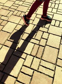 Low section of people walking on footpath