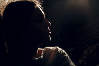 Close-up portrait of girl looking away