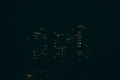 Illuminated buildings in city at night