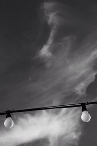 Low angle view of light bulb against sky