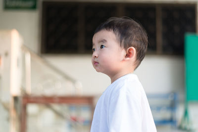 Portrait of cute boy looking away