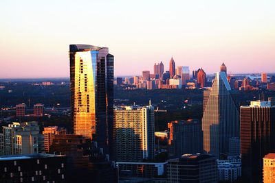 Skyscrapers in city against clear sky