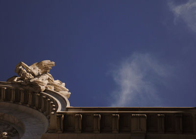 Low angle view of statue against sky