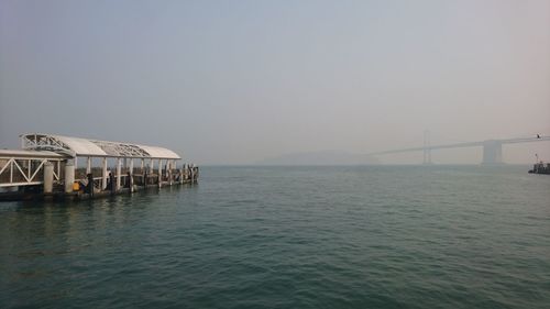 View of bridge over sea against clear sky