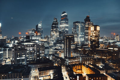 Illuminated buildings in city at night