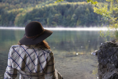 Rear view of woman looking at lake