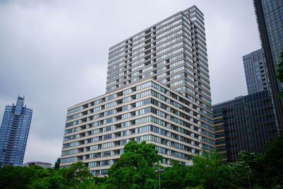 Low angle view of modern buildings against sky