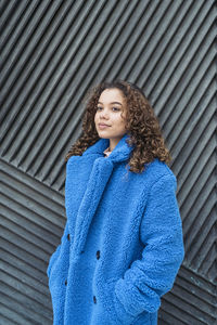 Portrait of a beautiful young woman looking away