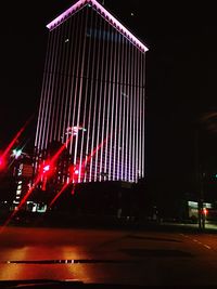 Low angle view of light trails at night