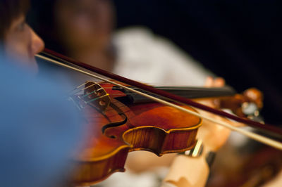 Close-up of woman playing violin