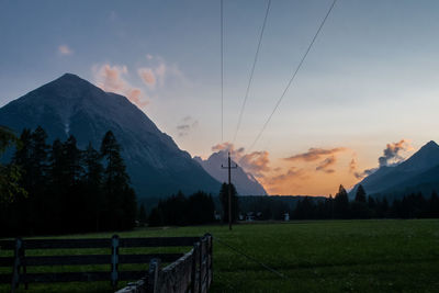 Scenic view of field against sky during sunset