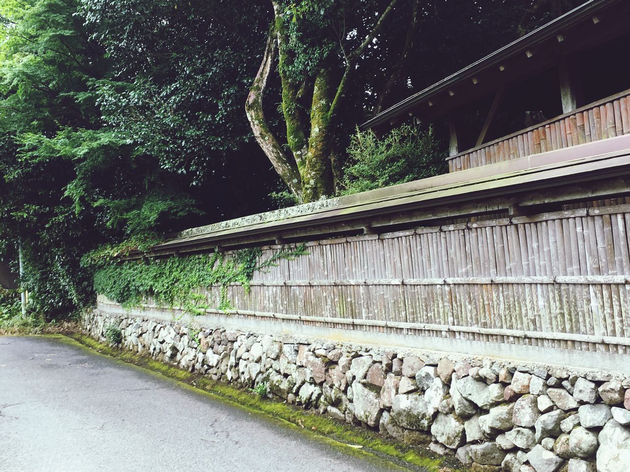 VIEW OF STONE WALL WITH BRIDGE