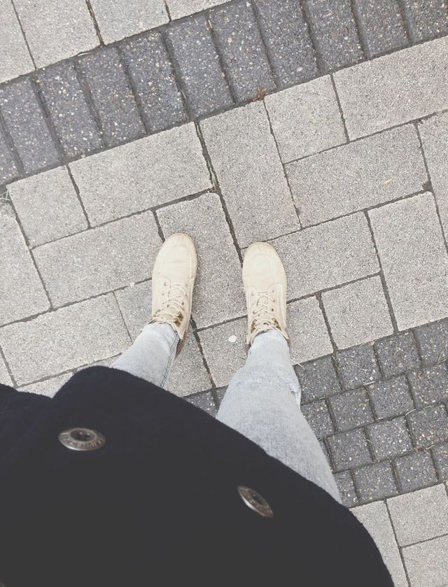 shoe, high angle view, low section, street, cobblestone, person, paving stone, personal perspective, footpath, standing, footwear, sidewalk, pavement, tiled floor, directly above, shadow, outdoors, day