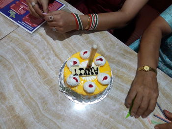 High angle view of woman holding text