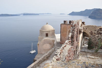 Panoramic view of sea and buildings against sky