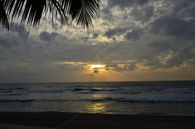 Scenic view of sea against sky at sunset