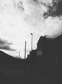 Low angle view of built structure against cloudy sky