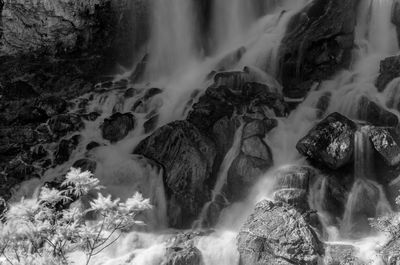 Scenic view of waterfall in sea