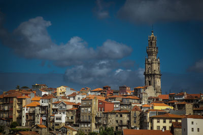 Buildings in town against sky