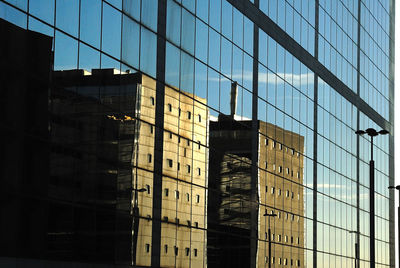 Reflection of buildings on glass window