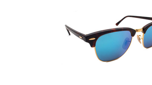 Close-up of sunglasses against white background