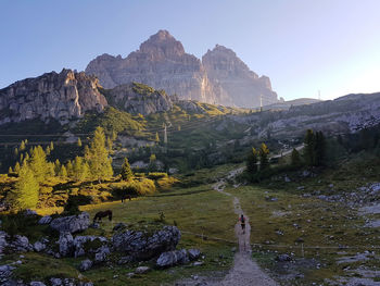 Scenic view of rocks in mountains against sky