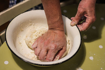 Close-up of person preparing food in bowl